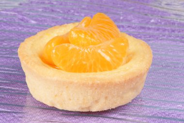 Mini tangerine fruit tart clipart