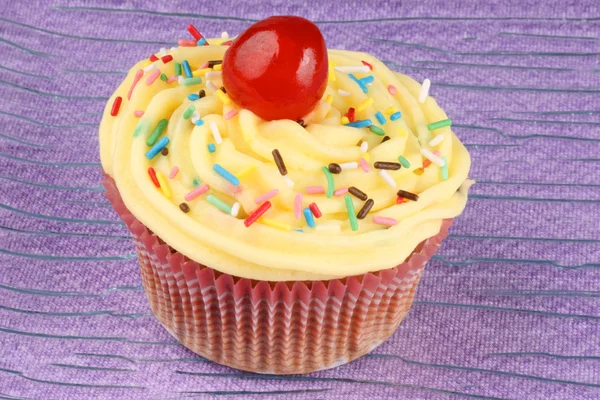Fancy cupcake with candied cherry — Stock Photo, Image