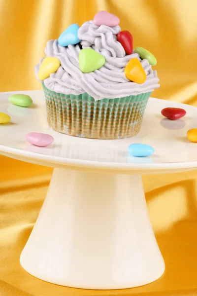 Cupcake with colorful sugar-coated hearts — Stock Photo, Image