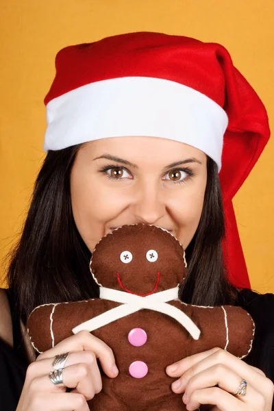 Santa Claus girl with gingerbread man puppet — Stock Photo, Image