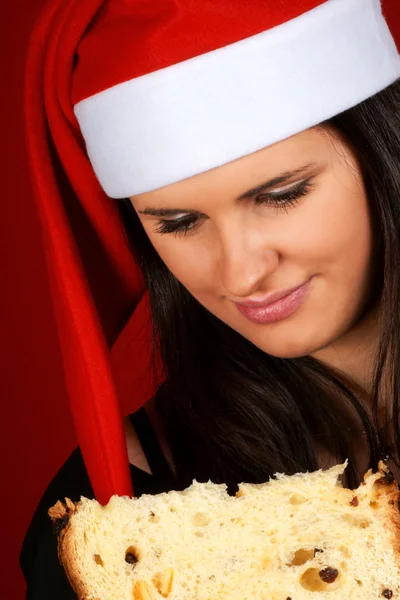 Babbo Natale ragazza mangiare panettone — Foto Stock