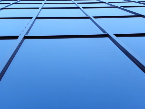 Blue square windows of office bulding in sharp angle