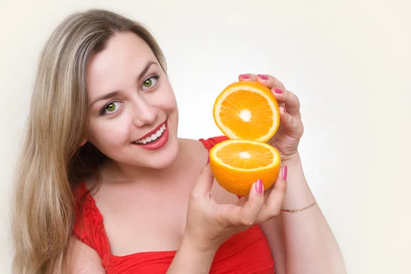 Attractive girl with orange — Stock Photo, Image