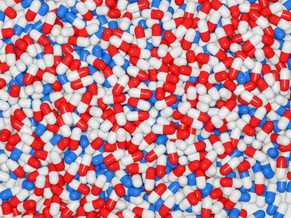Tło czerwone i niebieskie tabletki — Zdjęcie stockowe