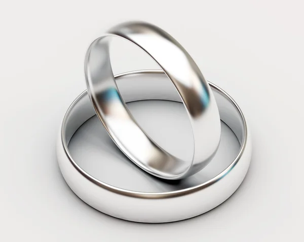 Anéis de casamento de platina no fundo branco — Fotografia de Stock