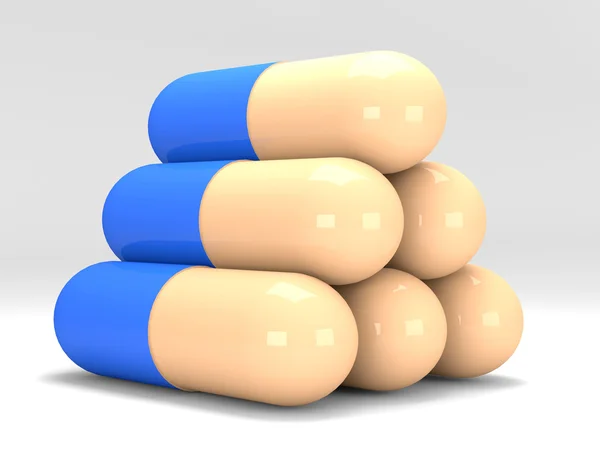 Pyramide de pilules sur fond blanc — Photo