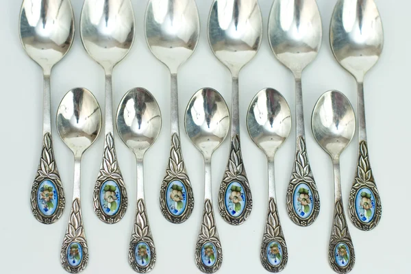 Antique silver spoons with a blue porcelain insert — Stock Photo, Image