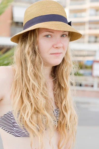 Portrait of blond girl in hat. — Stock Photo, Image
