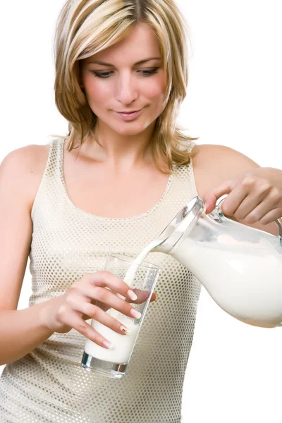 Woman pour out milk — Stock Photo, Image