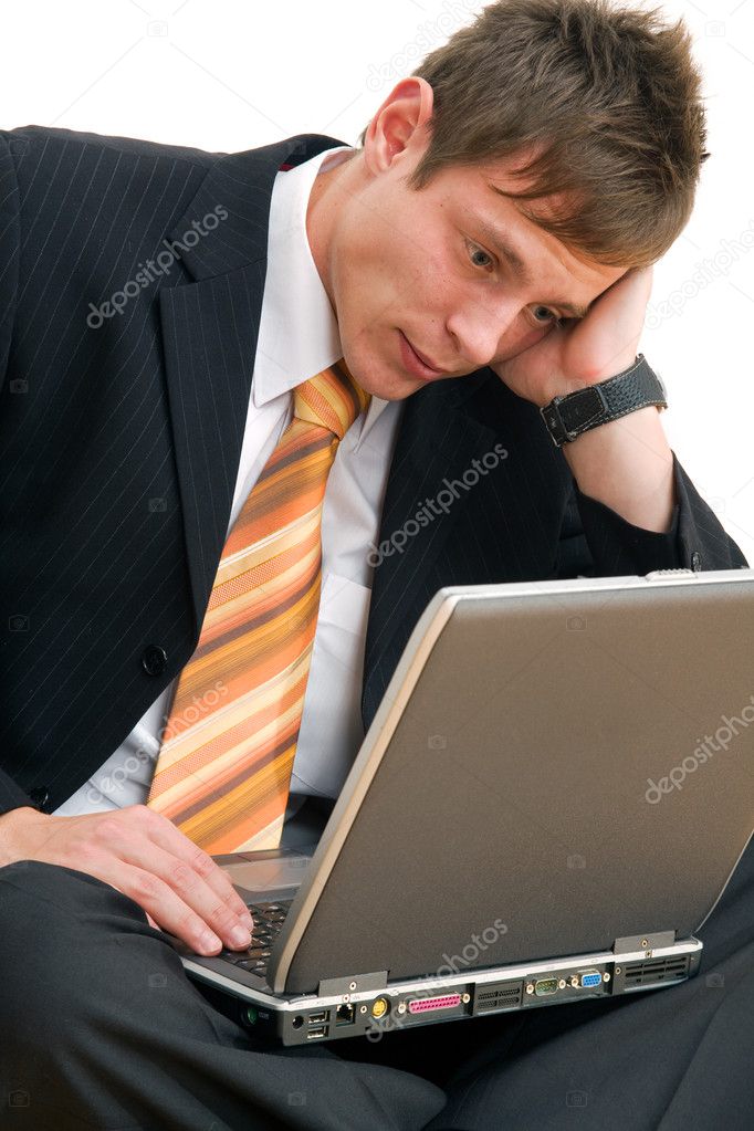 Unhappy businessman with computer