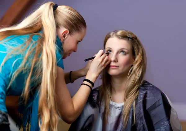 Make-up session - two young women — Stock Photo, Image
