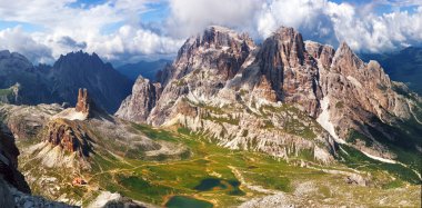 Panoramic view of high mountain in Italy clipart