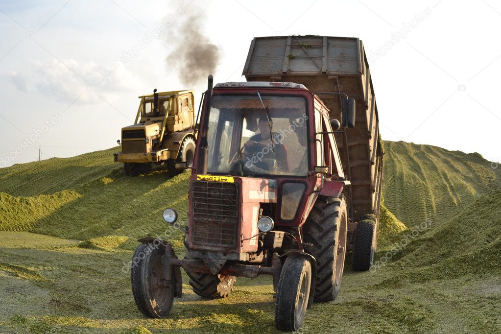 Tractor and the bulldozer on silo preparation.