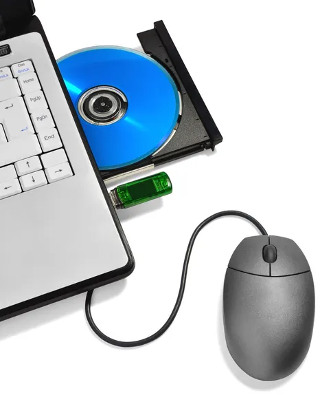 Přenosný počítač s otevřenou kompaktní disk zásobník, usb flash disk a myš Stock Snímky