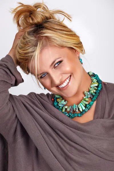 Blond smiling tanned woman — Stock Photo, Image