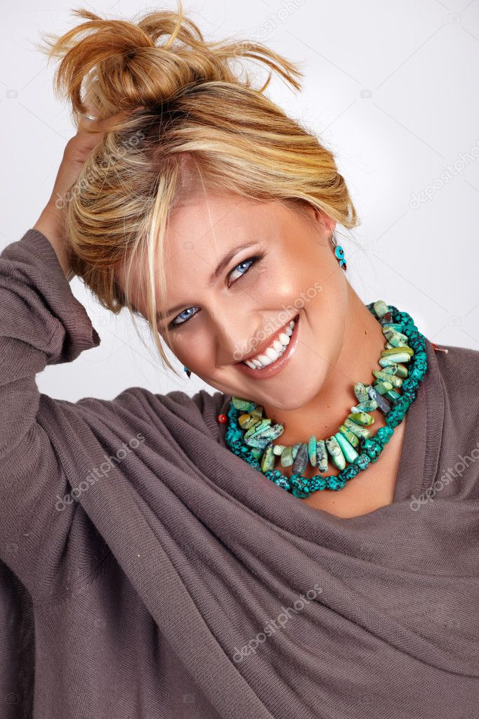 Blond smiling tanned woman