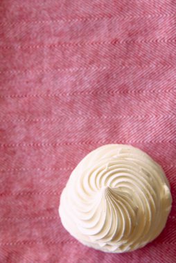 Tasty white meringue on a napkin. clipart