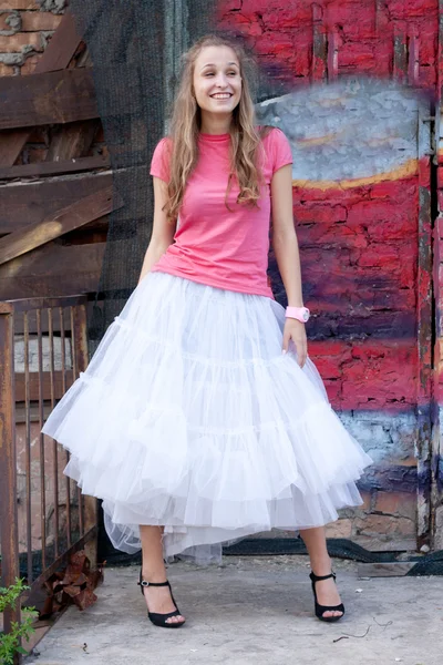 Girl in white skirt and pink T-shirt — Stock Photo, Image