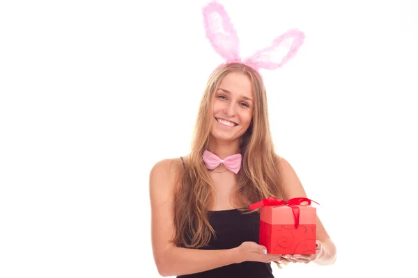Dívka, oblečený jako králík s dárky — Stock fotografie