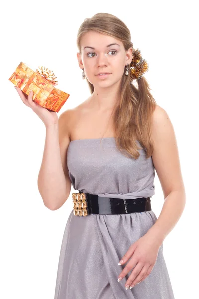 Girl celebrates Christmas with a gift in the hands — Stock Photo, Image
