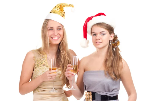 Dvě dívky slavit Vánoce s dárky a brýle v jejich rukou — Stock fotografie