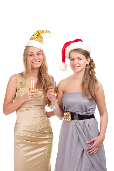 Дві дівчини святкують Різдво з подарунками та окулярами в руках — стокове фото