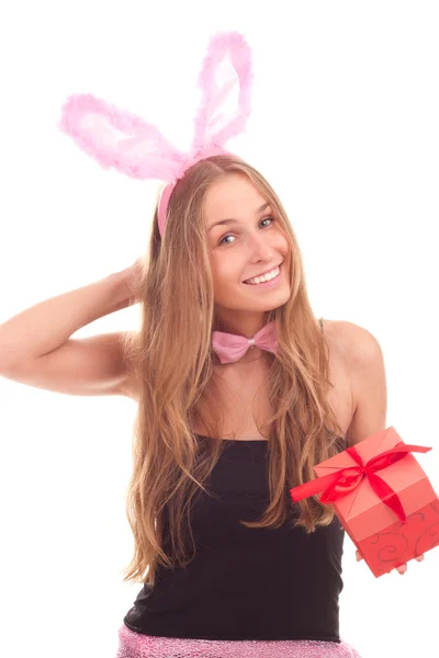 Una chica vestida de conejo con regalos Imagen de archivo