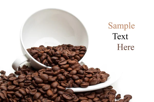 Xícara cheia com grãos de café — Fotografia de Stock