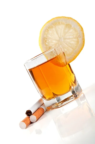 Cognac with lemon and cigarettes — Stock Photo, Image