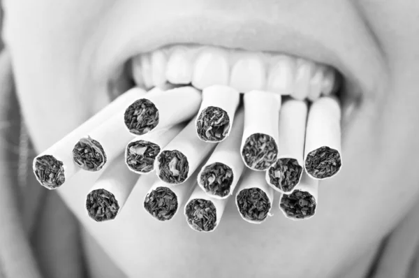 Cigarettes in mouth — Stock Photo, Image