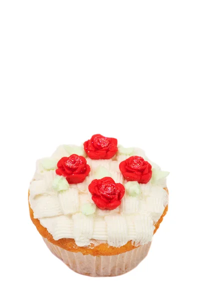 Ванільний кекс з кошиком з глазур'ю та трояндами Ліцензійні Стокові Фото