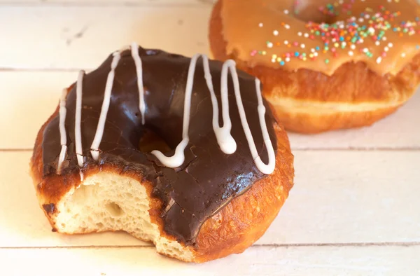 stock image Donuts covered in caramel and chocolate icing