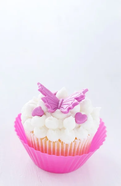 Vanilla cupcake with butterfly decorations — Stock Photo, Image