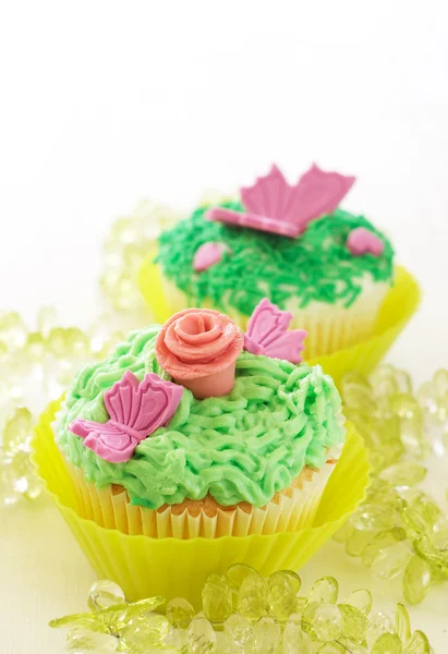 Vanilla cupcakes with various decorations — Stock Photo, Image