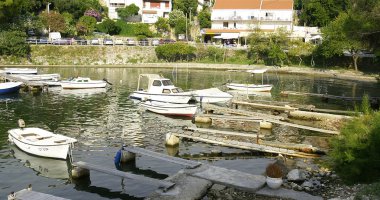 Beach and piers in Cavtat, Croatia. clipart