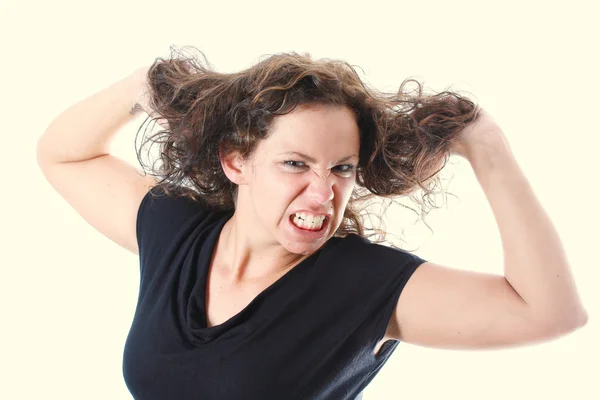 stock image Young woman is furious about her hair