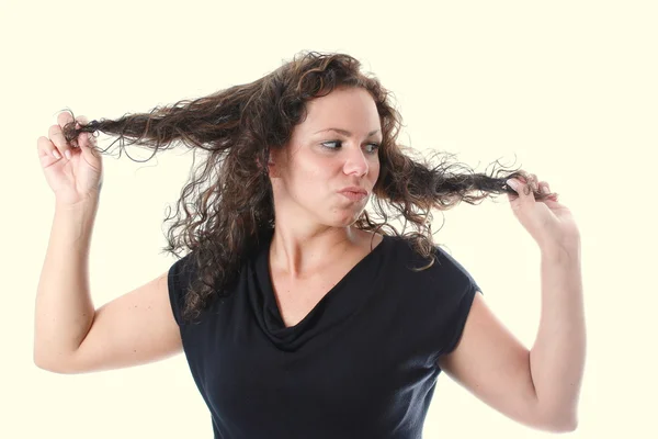 stock image Young woman is furious about her hair