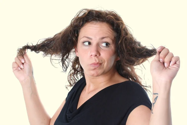 Stock image Young woman is furious about her hair