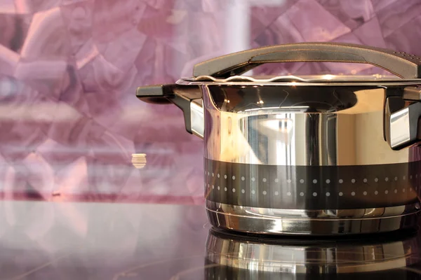 Stainless pot on cooker — Stock Photo, Image