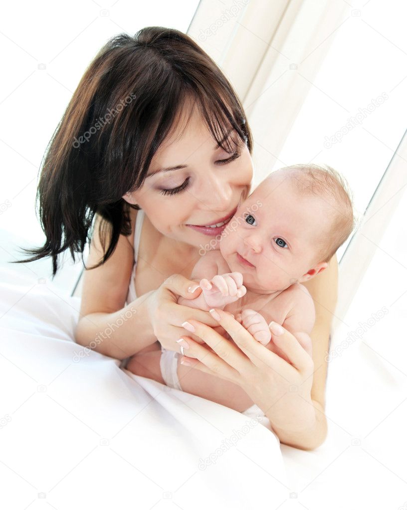Happy mother with a baby