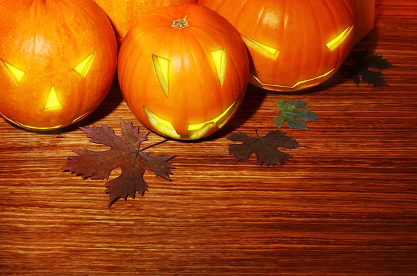 Glowing Halloween pumpkins border — Stock Photo, Image