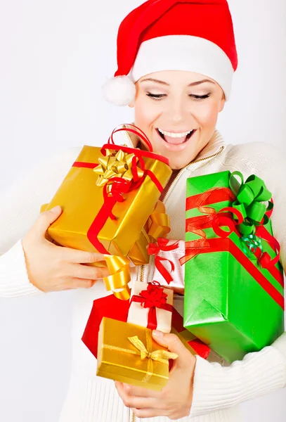 Счастливая Санта-девочка с подарками — стоковое фото