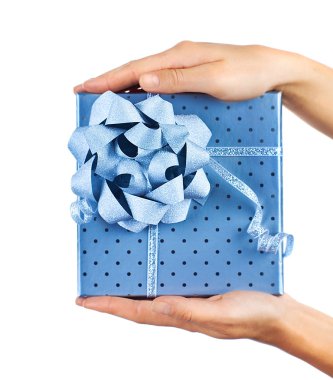 Female hands holding blue gift box clipart
