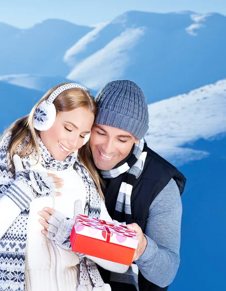 Happy couple outdoor at winter mountains — Stock Photo, Image