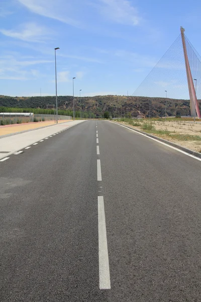 Straight tar road leading into — Stock Photo, Image