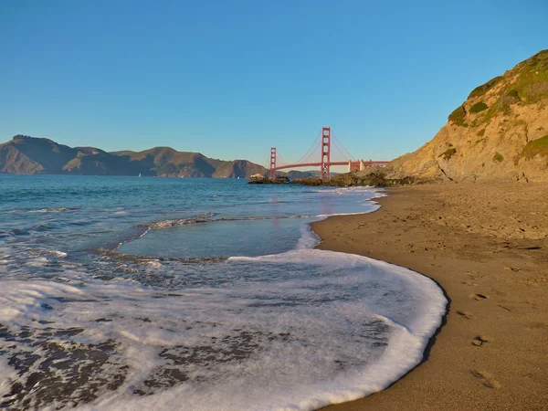 stock image Golden Gate Bridge view from Baker Beach just before sunset. No HDR