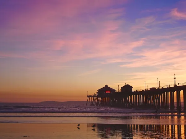 Sunset by the Huntington Beach Pier — Stok fotoğraf