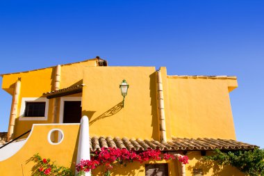 Mediterranean yellow houses in Cala Fornells Mallorca clipart