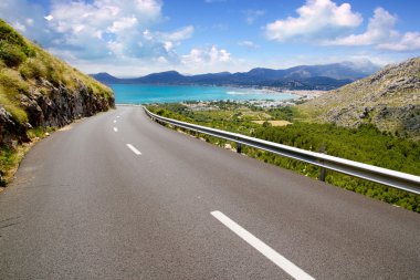 Curve of road in mountain with Pollensa view in Mallorca clipart