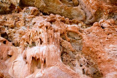 Cave outdoors in Majorca island with red stalactites clipart